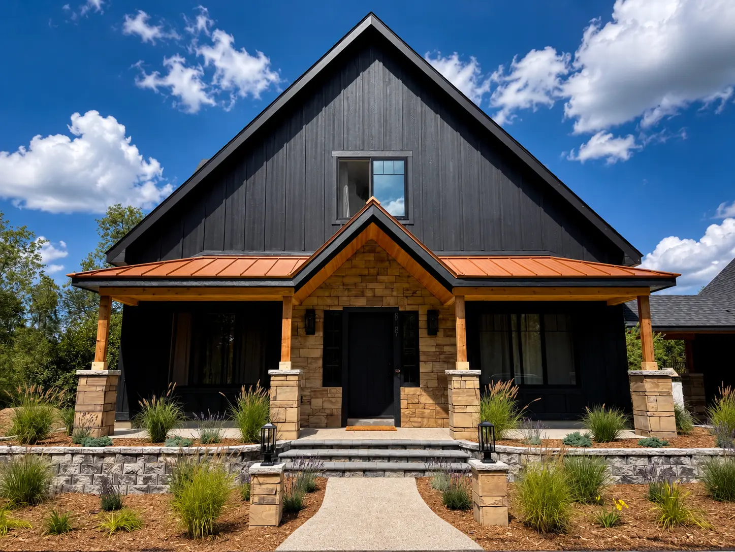 The house from the front, stone and copper under a blue sky